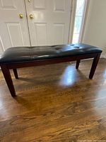 Full view of bench in front of doors