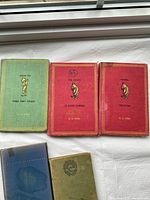 Front covers of the three clothbound books