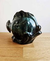 Rear angled view displaying open top and fin details