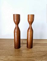 Front view of both teak candlesticks