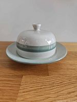 Butter dish assembled showing lid and plate, color, overall form