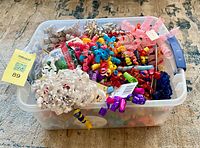 overview of tote filled with mixed curly ribbons and bows