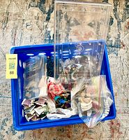 overall view of blue crate with thread, yarn and storage boxes