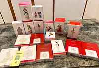 All 17 boxed ornaments displayed on table