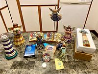 Group shot of all 11 Jim Shore pieces on countertop