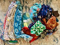 Overview of entire scarf lot showing variety of prints and colors