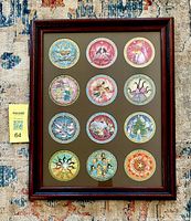 Full frontal view of framed ornament set
