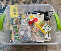 overview of bin filled with assorted stickers and scrapbook materials