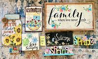 All eight decorative signs arranged on rug