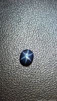 Front view of blue star sapphire showing six-ray star