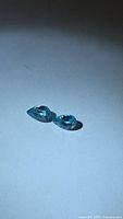 Pair of pear-cut blue zircons side by side