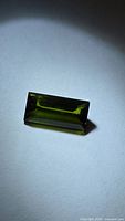 Rectangular green tourmaline gemstone, front view