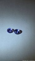 Pair of round tanzanite gemstones