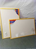 Both packaged whiteboards side by side