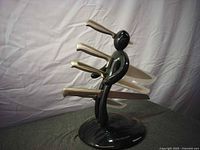 Overall view of black figure knife stand with four knives inserted