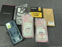All seven new cell phone cases displayed, showing variety of packaging and styles