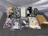 Overview of all sealed phone cases displayed on table