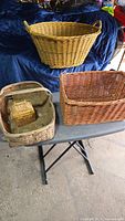 Group shot showing all five wicker baskets together