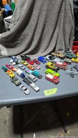 Overview of all die-cast vehicles on folding table