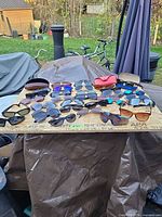 Overview of board holding all sunglasses and cases