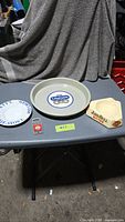 Overview of five breweriana items on table