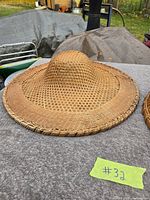 Open-weave straw warmer showing overall shape and weave