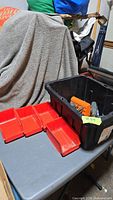 Overall lot showing tote and red bins