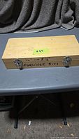 closed wooden case labeled 1/4-2 1/8 Forstner Bits