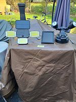 Both solar security lights on tabletop