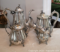 Full view of four-piece silver-plated tea and coffee set