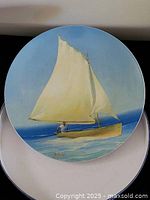 Front view of plate showing sailboat artwork