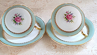 Pair of Aynsley teacups on saucers showing full set