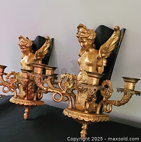 Front angled view of both gilt brass sconces