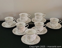 Seven matching Paragon cups and saucers displayed