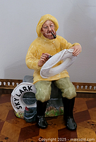 Front view of Royal Doulton The Boatman figurine holding life ring