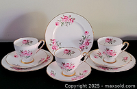 Front view of complete 9-piece tea trio set