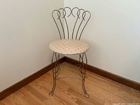 Full front view of metal vanity chair