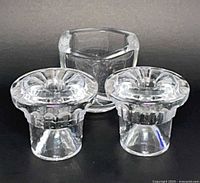 Front view of two Lars Hellsten crystal candle holders and Villeroy & Boch bowl