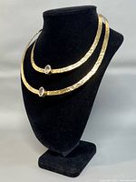Full view of two-row hammered choker on display bust