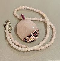 Full necklace coiled showing pendant front