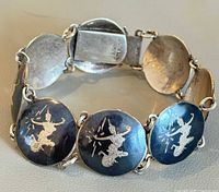 Bracelet closed showing round niello panels and clasp