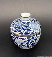 Front view of blue and white porcelain lidded jar