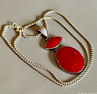 Full view of sterling silver box chain and red coral pendant