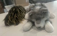 Timber Wolf and Porcupine puppets side by side on countertop