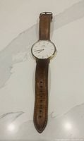 Front view of Daniel Wellington watch showing dial, case and strap