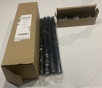 outer box with IFELS label, three rod sections and inner hardware box visible