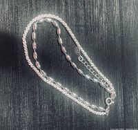 Full view of double-strand sterling bracelet laid flat showing both bead styles and extender chain