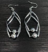 Front view of both earrings showing overall design and bead accents