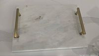 Top view of marble tray showing overall condition and brass handles