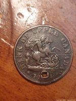 Obverse view showing full design, legend, date, and hole